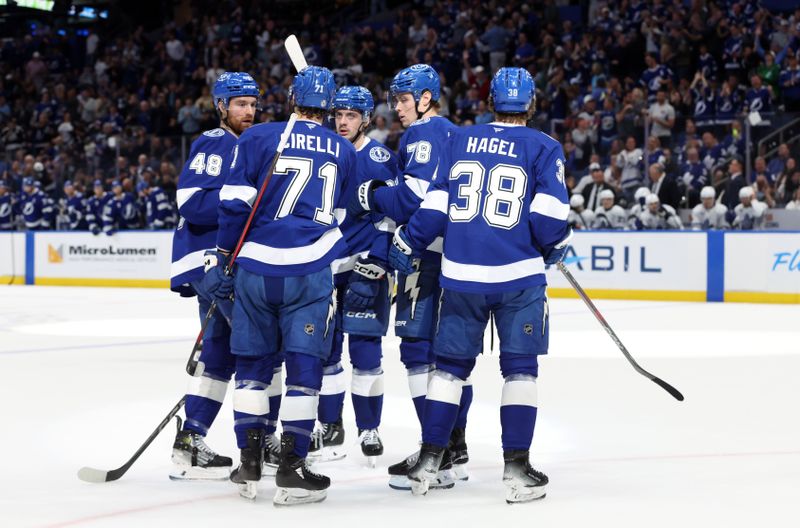 Apr 9, 2025; Tampa, Florida, USA; Tampa Bay Lightning defenseman Nick Perbix (48) is congratulated after the scored a goal against the Toronto Maple Leafs during the first period at Amalie Arena. Mandatory Credit: Kim Klement Neitzel-Imagn Images