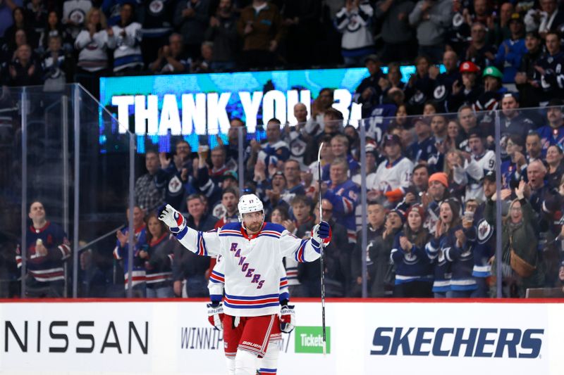 Oct 30, 2023; Winnipeg, Manitoba, CAN; New York Rangers right wing Blake Wheeler (17) salutes fans during a time out in the first period against the Winnipeg Jets at Canada Life Centre. Mandatory Credit: James Carey Lauder-USA TODAY Sports