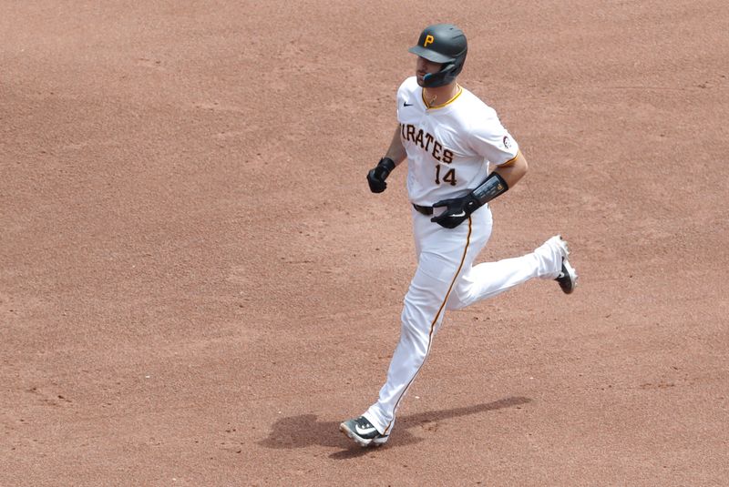 May 23, 2024; Pittsburgh, Pennsylvania, USA; Pittsburgh Pirates catcher Joey Bart (14) circles the bases after hitting a grand slam against the San Francisco Giants during the fourth inning at PNC Park. Mandatory Credit: Charles LeClaire-USA TODAY Sports