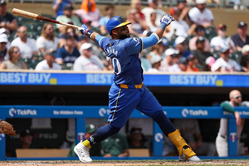 Jun 16, 2024; Minneapolis, Minnesota, USA; Minnesota Twins first baseman Carlos Santana (30) hits a two-run home run against the Oakland Athletics during the seventh inning of game one of a double header at Target Field. Mandatory Credit: Matt Krohn-USA TODAY Sports