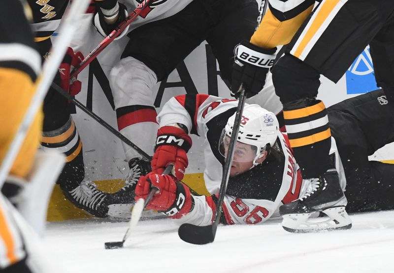 Nov 16, 2023; Pittsburgh, Pennsylvania, USA; New Jersey Devils left wing Erik Haula (56) moves the puck while on the ice against the Pittsburgh Penguins during the second period at PPG Paints Arena. Mandatory Credit: Philip G. Pavely-USA TODAY Sports