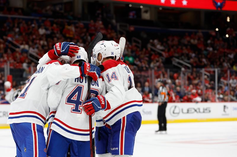 Oct 31, 2024; Washington, District of Columbia, USA; Montreal Canadiens center Nick Suzuki (14) celebrates with teammates after scoring a goal against the Washington Capitals in the second period at Capital One Arena. Mandatory Credit: Geoff Burke-Imagn Images