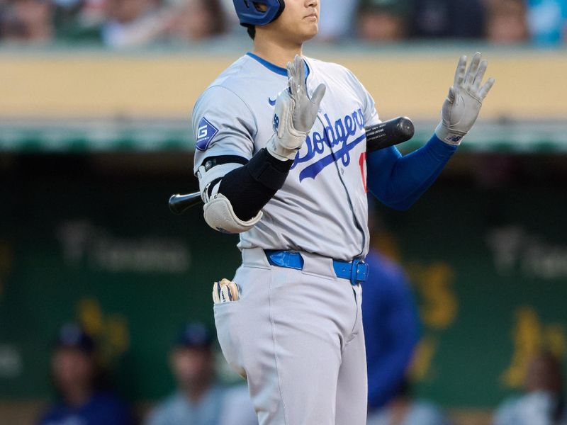 Aug 3, 2024; Oakland, California, USA; Los Angeles Dodgers designated hitter Shohei Ohtani (17) calls for time while batting against the Oakland Athletics during the seventh inning at Oakland-Alameda County Coliseum. Mandatory Credit: Robert Edwards-USA TODAY Sports