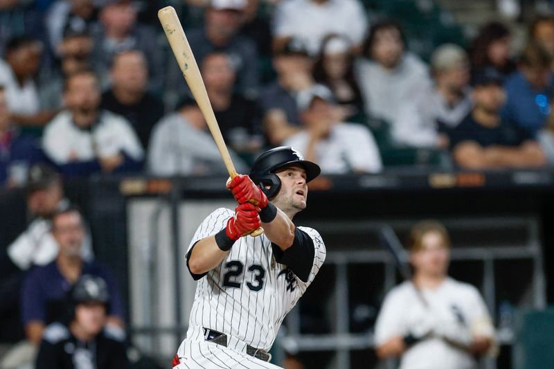 Aug 27, 2025; Chicago, Illinois, USA; Chicago White Sox left fielder Andrew Benintendi (23) hits a solo home run against the Kansas City Royals during the fourth inning at Rate Field. Mandatory Credit: Kamil Krzaczynski-Imagn Images