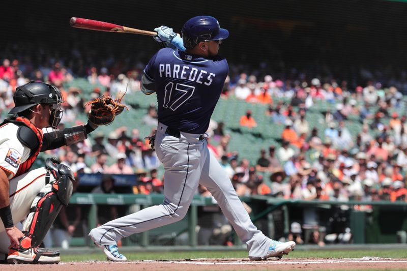 Aug 16, 2023; San Francisco, California, USA; Tampa Bay Rays third baseman Isaac Paredes (17) hits an rbi single during the first inning against the San Francisco Giants at Oracle Park. Mandatory Credit: Sergio Estrada-USA TODAY Sports