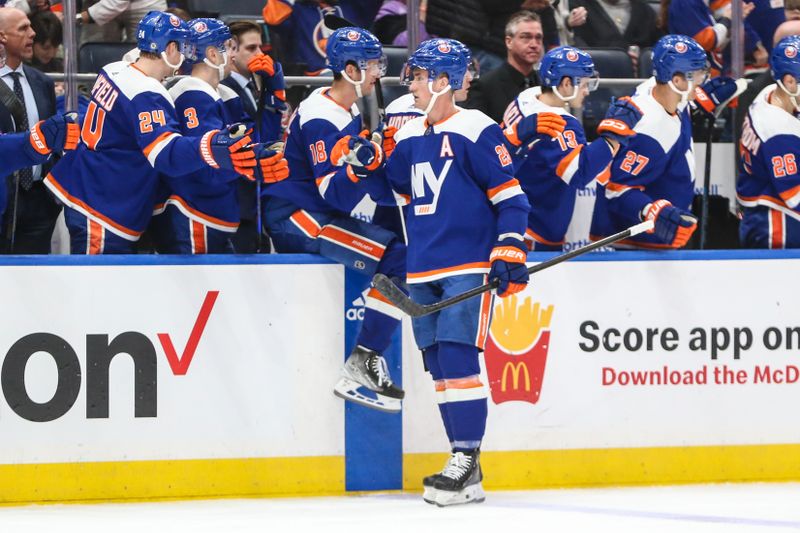 Feb 10, 2024; Elmont, New York, USA;  New York Islanders center Brock Nelson (29) celebrates with his teammates after scoring a goal in the third period against the Calgary Flames at UBS Arena. Mandatory Credit: Wendell Cruz-USA TODAY Sports