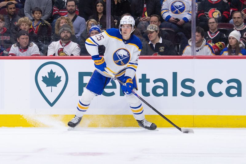Dec 23, 2025; Ottawa, Ontario, CAN; Buffalo Sabres defenseman Owen Power (25) controls the puck in the first period against the Ottawa Senators at the Canadian Tire Centre. Mandatory Credit: Marc DesRosiers-IMAGN Images