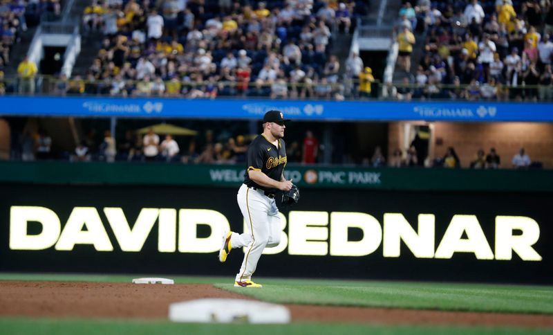 Jun 4, 2024; Pittsburgh, Pennsylvania, USA;  Pittsburgh Pirates relief pitcher David Bednar (51) comes on to pitch against the Los Angeles Dodgers during the ninth inning at PNC Park. The Pirates shutout the Dodgers 1-0. Mandatory Credit: Charles LeClaire-USA TODAY Sports