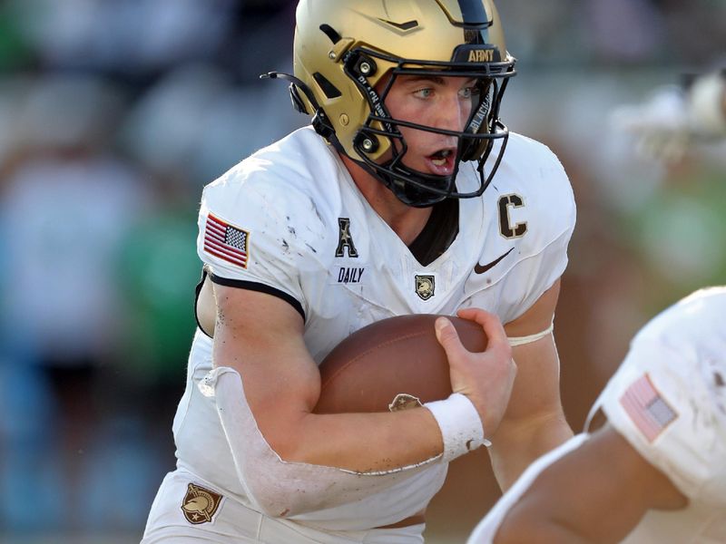Nov 9, 2024; Denton, Texas, USA; Army Black Knights quarterback Bryson Daily (13) carries the ball against the North Texas Mean Green during the first half at DATCU Stadium. Mandatory Credit: Danny Wild-Imagn Images