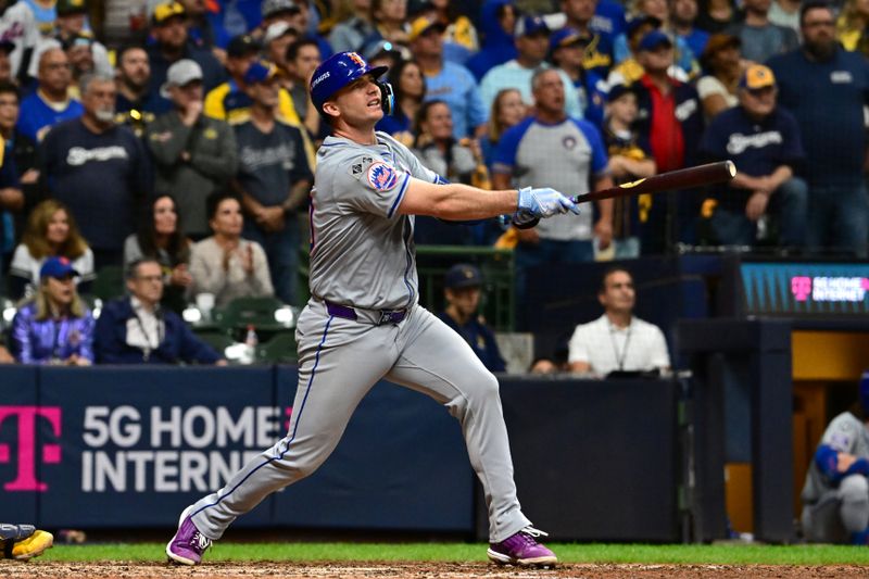 Oct 3, 2024; Milwaukee, Wisconsin, USA; New York Mets first baseman Pete Alonso (20) hits a three run home run against the Milwaukee Brewers in the ninth inning during game three of the Wildcard round for the 2024 MLB Playoffs at American Family Field. Mandatory Credit: Benny Sieu-Imagn Images