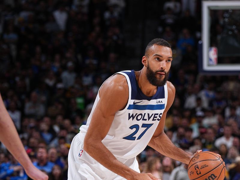 DENVER, CO - APRIL 10: Rudy Gobert #27 of the Minnesota Timberwolves dribbles the ball during the game against the Denver Nuggets on April 10, 2024 at the Ball Arena in Denver, Colorado. NOTE TO USER: User expressly acknowledges and agrees that, by downloading and/or using this Photograph, user is consenting to the terms and conditions of the Getty Images License Agreement. Mandatory Copyright Notice: Copyright 2024 NBAE (Photo by Garrett Ellwood/NBAE via Getty Images)