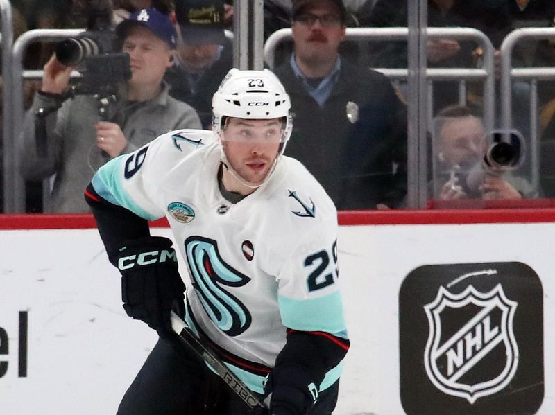 Jan 14, 2025; Pittsburgh, Pennsylvania, USA;  Seattle Kraken defenseman Vince Dunn (29) skates with the puck against the Pittsburgh Penguins during the second period at PPG Paints Arena. Mandatory Credit: Charles LeClaire-Imagn Images