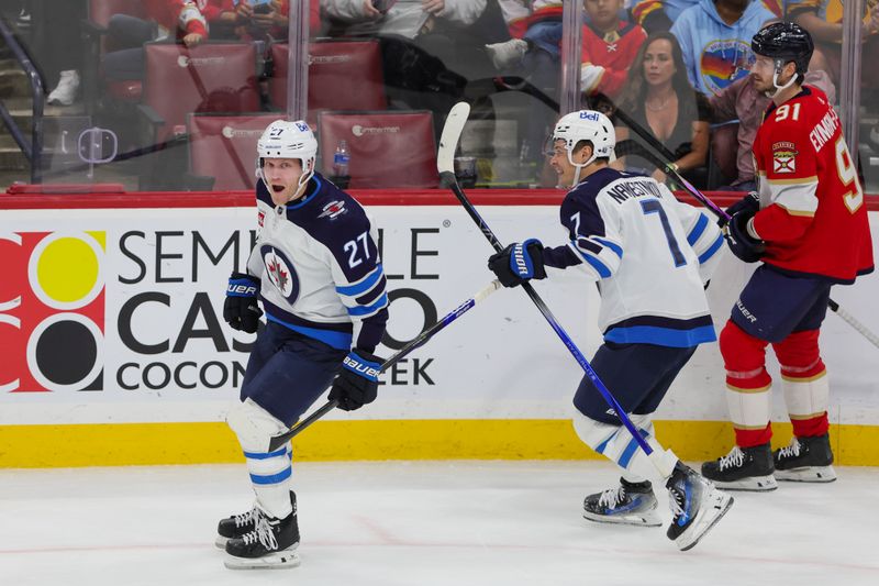 Nov 24, 2023; Sunrise, Florida, USA; Winnipeg Jets left wing Nikolaj Ehlers (27) celebrates after scoring against the Florida Panthers during the third period at Amerant Bank Arena. Mandatory Credit: Sam Navarro-USA TODAY Sports