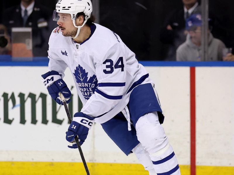 Dec 12, 2023; New York, New York, USA; Toronto Maple Leafs center Auston Matthews (34) skates with the puck against the New York Rangers during the second period at Madison Square Garden. Mandatory Credit: Brad Penner-USA TODAY Sports