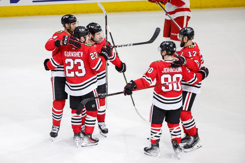 Feb 25, 2024; Chicago, Illinois, USA; Chicago Blackhawks left wing Nick Foligno (17) celebrates with teammates after scoring against the Detroit Red Wings during the second period at United Center. Mandatory Credit: Kamil Krzaczynski-USA TODAY Sports