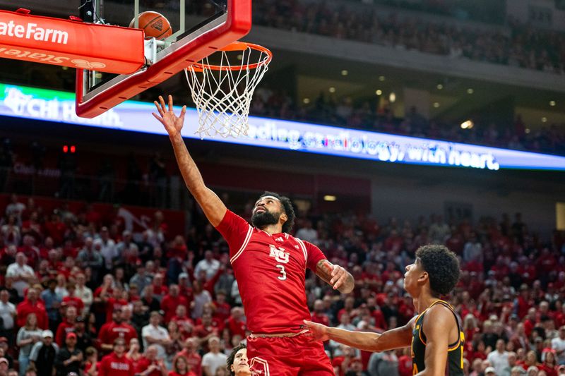 Feb 25, 2024; Lincoln, Nebraska, USA; Nebraska Cornhuskers guard Brice Williams (3) shoots the ball against Minnesota Golden Gophers guard Mike Mitchell Jr. (2) and guard Cam Christie (24) during the first half at Pinnacle Bank Arena. Mandatory Credit: Dylan Widger-USA TODAY Sports