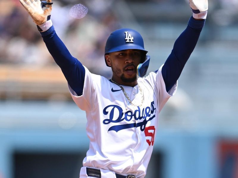 Apr 20, 2024; Los Angeles, California, USA; Los Angeles Dodgers shortstop Mookie Betts (50) celebrates altering hitting a double against the New York Mets during the first inning at Dodger Stadium. Mandatory Credit: Jonathan Hui-USA TODAY Sports