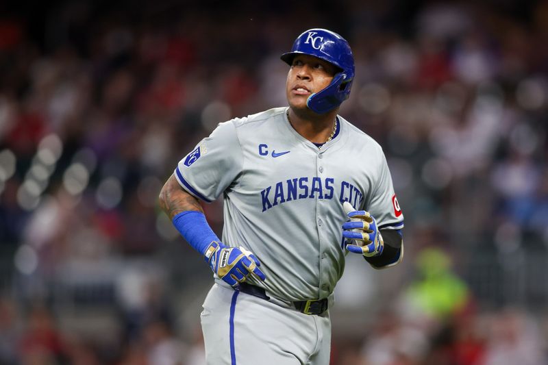 Sep 27, 2024; Atlanta, Georgia, USA; Kansas City Royals catcher Salvador Perez (13) runs off the field against the Atlanta Braves in the second inning at Truist Park. Mandatory Credit: Brett Davis-Imagn Images