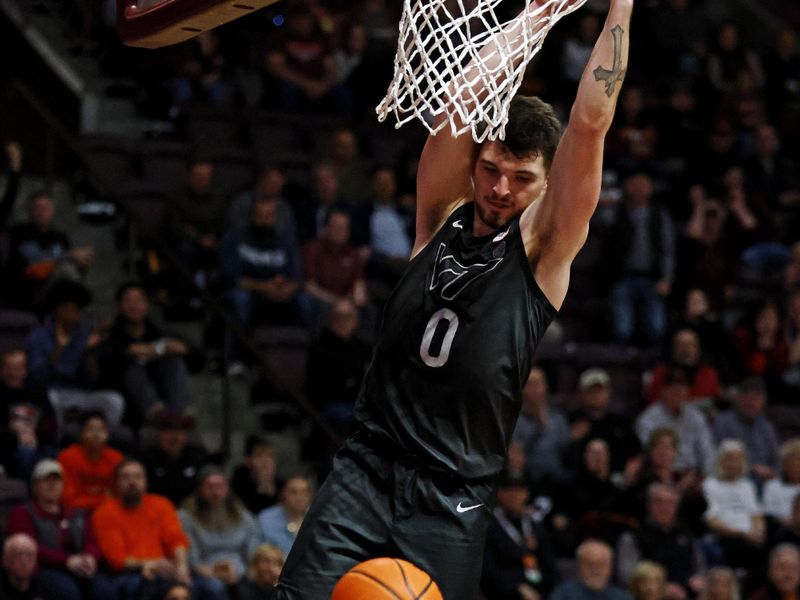 Jan 23, 2024; Blacksburg, Virginia, USA; Virginia Tech Hokies guard Hunter Cattoor (0) dunks the ball during the second half against the Boston College Eagles at Cassell Coliseum. Mandatory Credit: Peter Casey-USA TODAY Sports