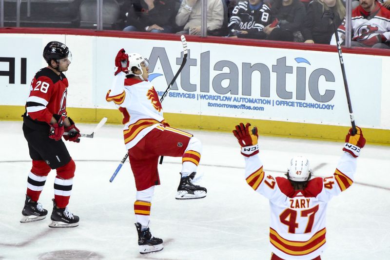 Feb 8, 2024; Newark, New Jersey, USA; Calgary Flames left wing Andrei Kuzmenko (96) reacts after scoring a goal against the New Jersey Devils during the third period at Prudential Center. Mandatory Credit: John Jones-USA TODAY Sports