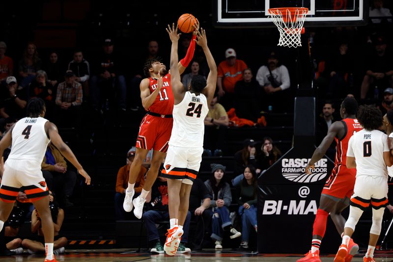 Jan 26, 2023; Corvallis, Oregon, USA; Utah Utes guard Wilguens Jr. Exacte (11) shoots under pressure from Oregon State Beavers center KC Ibekwe (24) during the first half at Gill Coliseum. Mandatory Credit: Soobum Im-USA TODAY Sports