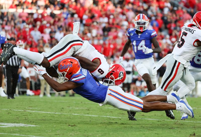 Oct 28, 2023; Jacksonville, Florida, USA; Florida Gators cornerback Jason Marshall Jr. (3) tackles Georgia Bulldogs wide receiver Dominic Lovett (6) during the second half at EverBank Stadium. Mandatory Credit: Kim Klement Neitzel-USA TODAY Sports