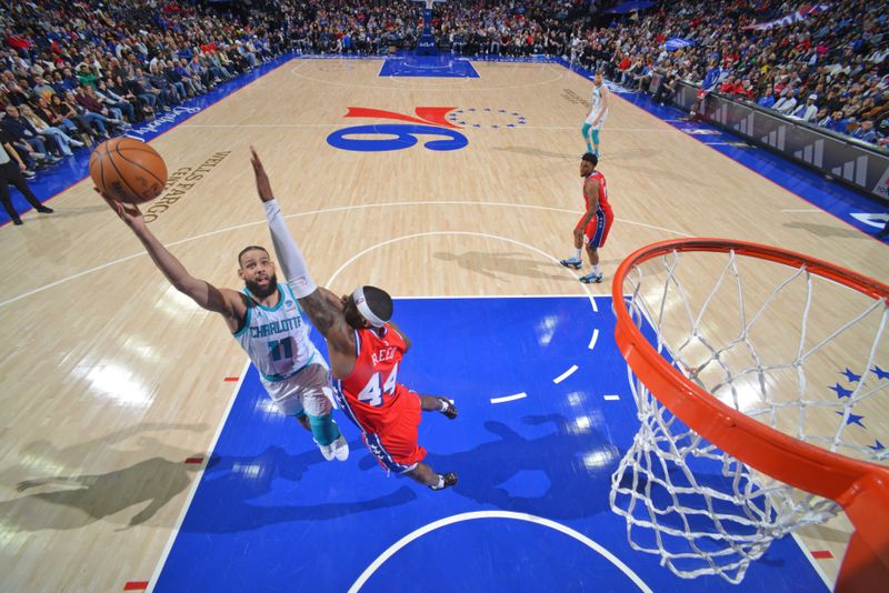 PHILADELPHIA, PA - MARCH 1: Cody Martin #11 of the Charlotte Hornets drives to the basket during the game /apj/ on March 1, 2024 at the Wells Fargo Center in Philadelphia, Pennsylvania NOTE TO USER: User expressly acknowledges and agrees that, by downloading and/or using this Photograph, user is consenting to the terms and conditions of the Getty Images License Agreement. Mandatory Copyright Notice: Copyright 2024 NBAE (Photo by Jesse D. Garrabrant/NBAE via Getty Images)