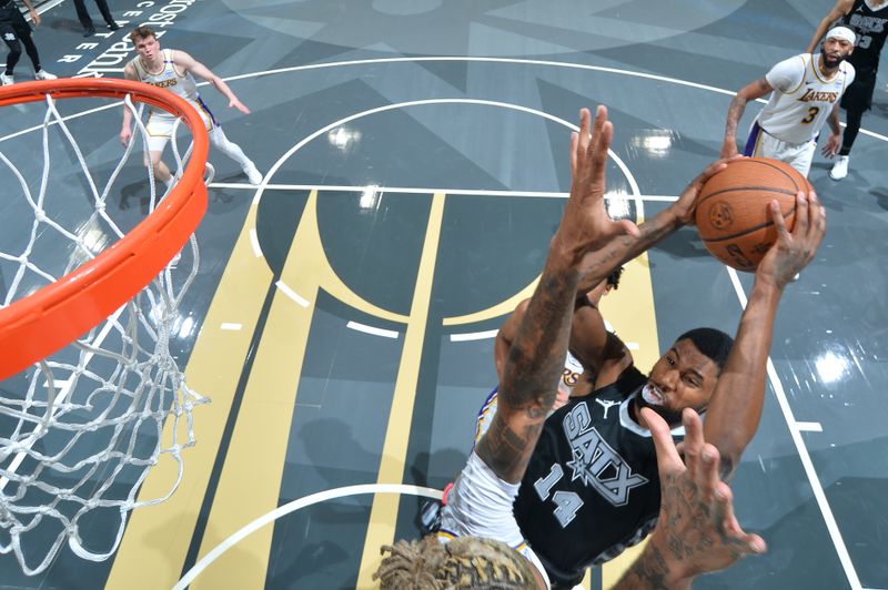 SAN ANTONIO, TX - OCTOBER 22:  Blake Wesley #14 of the San Antonio Spurs drives to the basket during the NBA Cup game against the Los Angeles Lakers on October 22, 2024 at the Frost Bank Center in San Antonio, Texas. NOTE TO USER: User expressly acknowledges and agrees that, by downloading and or using this photograph, user is consenting to the terms and conditions of the Getty Images License Agreement. Mandatory Copyright Notice: Copyright 2024 NBAE (Photos by Michael Gonzales/NBAE via Getty Images)