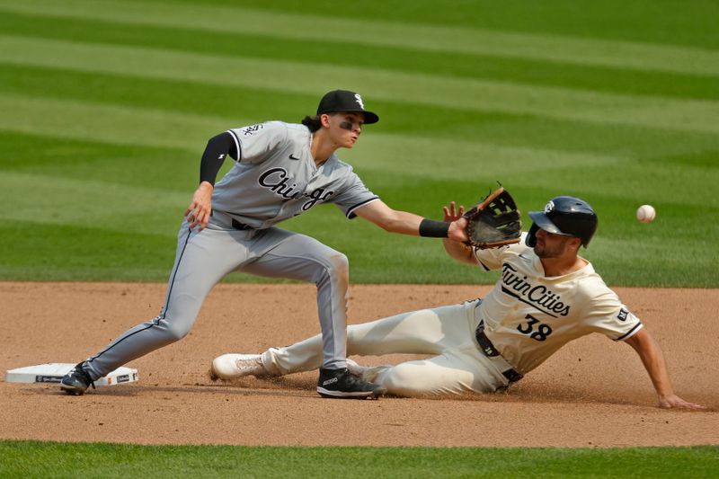 Aug 4, 2024; Minneapolis, Minnesota, USA; Minnesota Twins left fielder Matt Wallner (38) steals second base as Chicago White Sox second baseman Brooks Baldwin (27) tries to handle the throw in the seventh inning at Target Field. Mandatory Credit: Bruce Kluckhohn-USA TODAY Sports