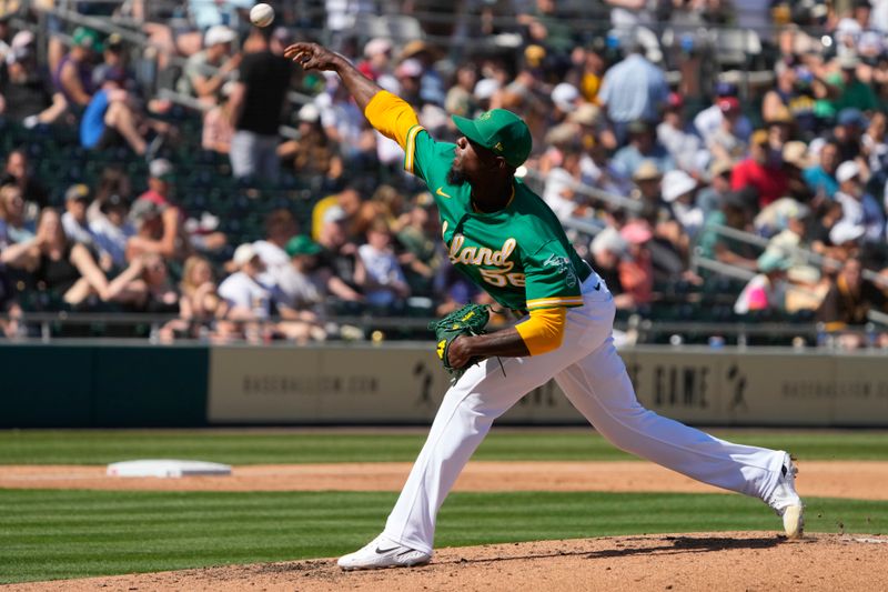 Mar 12, 2023; Mesa, Arizona, USA; Oakland Athletics relief pitcher Dany Jimenez (56) throws against the San Diego Padres in the third inning at Hohokam Stadium. Mandatory Credit: Rick Scuteri-USA TODAY Sports