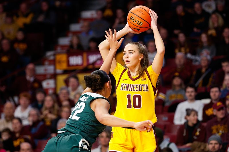 Jan 20, 2024; Minneapolis, Minnesota, USA; Minnesota Golden Gophers guard Mara Braun (10) looks to pass as Michigan State Spartans guard Moira Joiner (22) defends during the first half at Williams Arena. Mandatory Credit: Matt Krohn-USA TODAY Sports