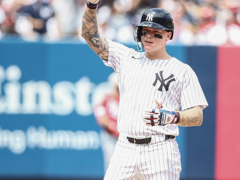 Jul 4, 2024; Bronx, New York, USA; New York Yankees left fielder Alex Verdugo (24) gestures after hitting a double in the fourth inning against the Cincinnati Reds at Yankee Stadium. Mandatory Credit: Wendell Cruz-USA TODAY Sports