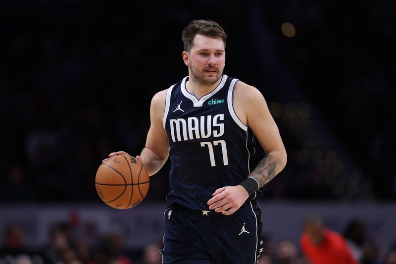 WASHINGTON, DC - NOVEMBER 15: Luka Doncic #77 of the Dallas Mavericks dribbles the ball against the Washington Wizards during the first half at Capital One Arena on November 15, 2023 in Washington, DC. NOTE TO USER: User expressly acknowledges and agrees that, by downloading and or using this photograph, User is consenting to the terms and conditions of the Getty Images License Agreement. (Photo by Patrick Smith/Getty Images)