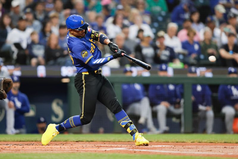 Sep 26, 2025; Seattle, Washington, USA; Seattle Mariners center fielder Julio Rodríguez (44) hits an RBI double against the Los Angeles Dodgers during the first inning at T-Mobile Park. Mandatory Credit: John Froschauer-Imagn Images