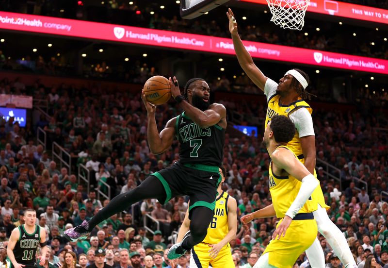 BOSTON, MASSACHUSETTS - MAY 23: Jaylen Brown #7 of the Boston Celtics drives to the basket against Myles Turner #33 of the Indiana Pacers during the third quarter during the third quarter in Game Two of the Eastern Conference Finals at TD Garden on May 23, 2024 in Boston, Massachusetts. NOTE TO USER: User expressly acknowledges and agrees that, by downloading and or using this photograph, User is consenting to the terms and conditions of the Getty Images License Agreement. (Photo by Maddie Meyer/Getty Images)