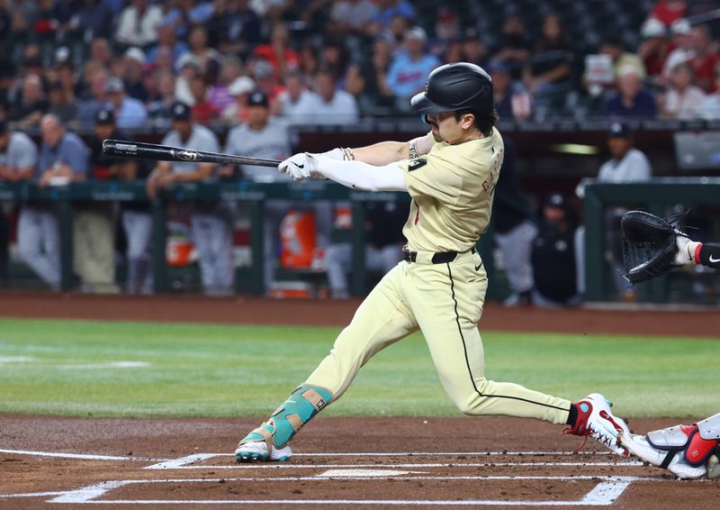 Jun 25, 2024; Phoenix, Arizona, USA; Arizona Diamondbacks outfielder Corbin Carroll hits a first inning single against the Minnesota Twins at Chase Field. Mandatory Credit: Mark J. Rebilas-USA TODAY Sports