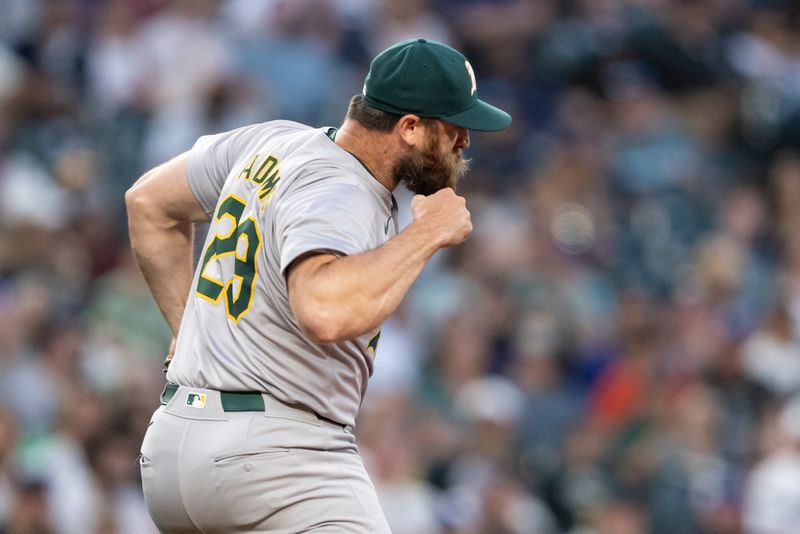 May 11, 2024; Seattle, Washington, USA; Oakland Athletics reliever Austin Adams (29) pumps his fist after the final out of the seventh inning against the Seattle Mariners at T-Mobile Park. Mandatory Credit: Stephen Brashear-USA TODAY Sports