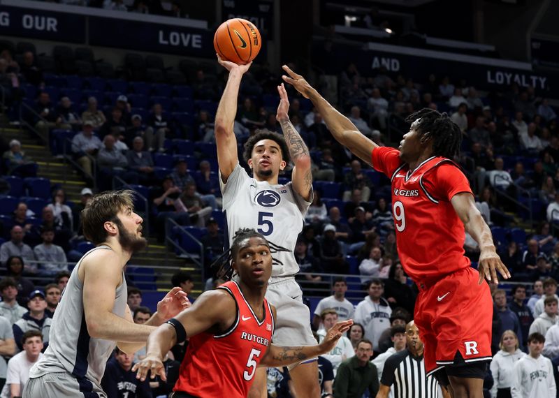 Feb 18, 2026; University Park, Pennsylvania, USA; Penn State Nittany Lions guard Freddie Dilione V (5) shoots the ball as Rutgers Scarlet Knights guard Darren Buchanan Jr (5) defends during the first half at Bryce Jordan Center. Mandatory Credit: Matthew O'Haren-Imagn Images