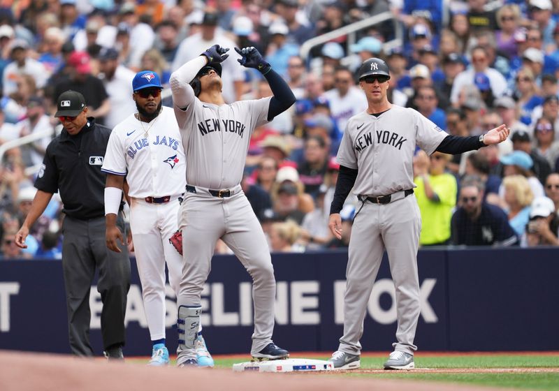 Jun 30, 2024; Toronto, Ontario, CAN; New York Yankees right fielder Juan Soto (22) celebrates hitting a single against the Toronto Blue Jays during the first inning at Rogers Centre. Mandatory Credit: Nick Turchiaro-USA TODAY Sports