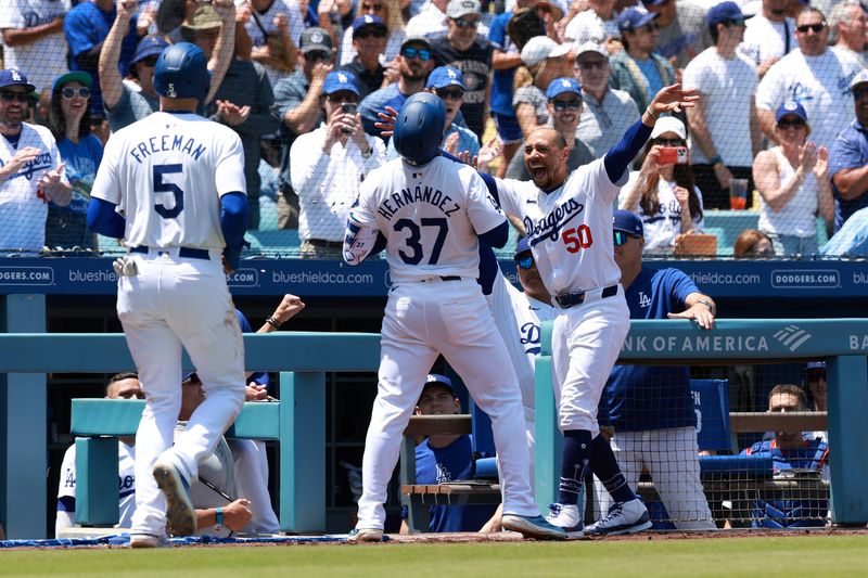 May 8, 2024; Los Angeles, California, USA;  Los Angeles Dodgers outfielder Teoscar Hernandez (37) celebrates with shortstop Mookie Betts (50) after hitting a two-run home run during the sixth inning against the Miami Marlins at Dodger Stadium. Mandatory Credit: Kiyoshi Mio-USA TODAY Sports