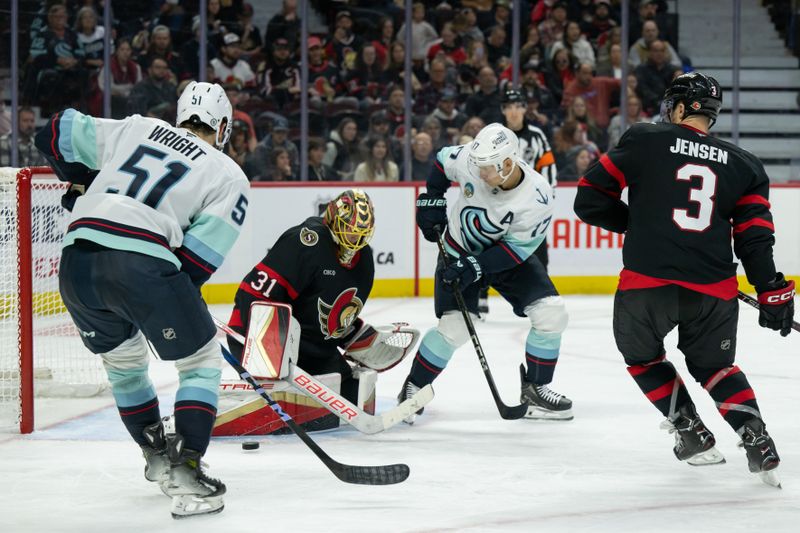 Nov 2, 2024; Ottawa, Ontario, CAN; Ottawa Senators goalie Anton Forsberg (31) makes a save in front of Seattle Kraken centers Shane Wright (51) and Jaden Schwartz (17) in the second period at the Canadian Tire Centre. Mandatory Credit: Marc DesRosiers-Imagn Images