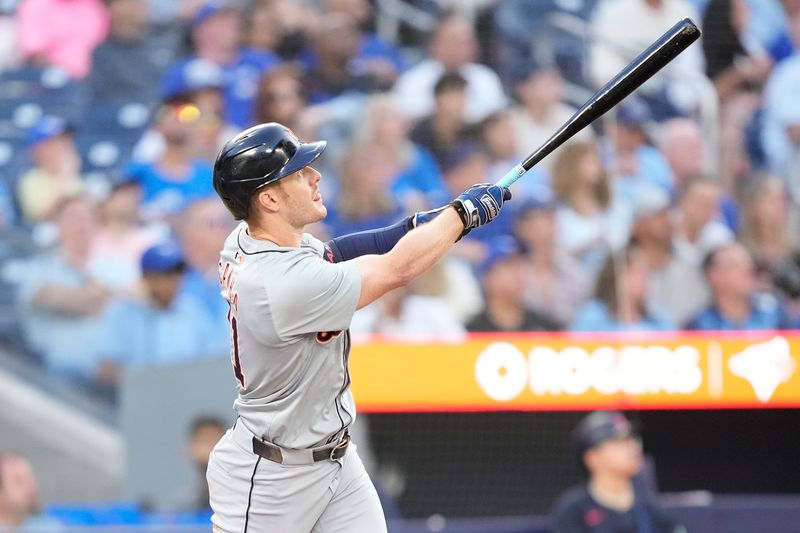 Jul 19, 2024; Toronto, Ontario, CAN; Detroit Tigers designated hitter Mark Canha (21) hits a two run home run against the Toronto Blue Jays during the fourth inning at Rogers Centre. Mandatory Credit: John E. Sokolowski-USA TODAY Sports