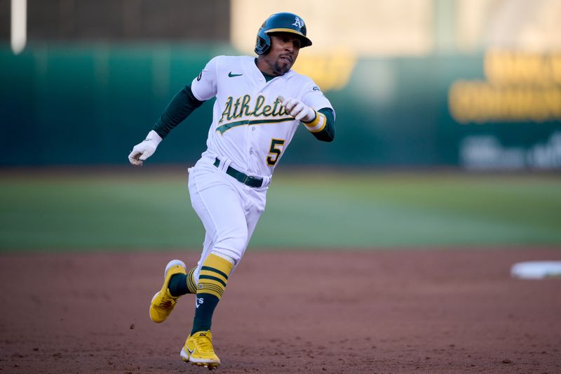 Aug 7, 2023; Oakland, California, USA; Oakland Athletics infielder Tony Kemp (5) runs toward third base against the Texas Rangers during the third inning at Oakland-Alameda County Coliseum. Mandatory Credit: Robert Edwards-USA TODAY Sports