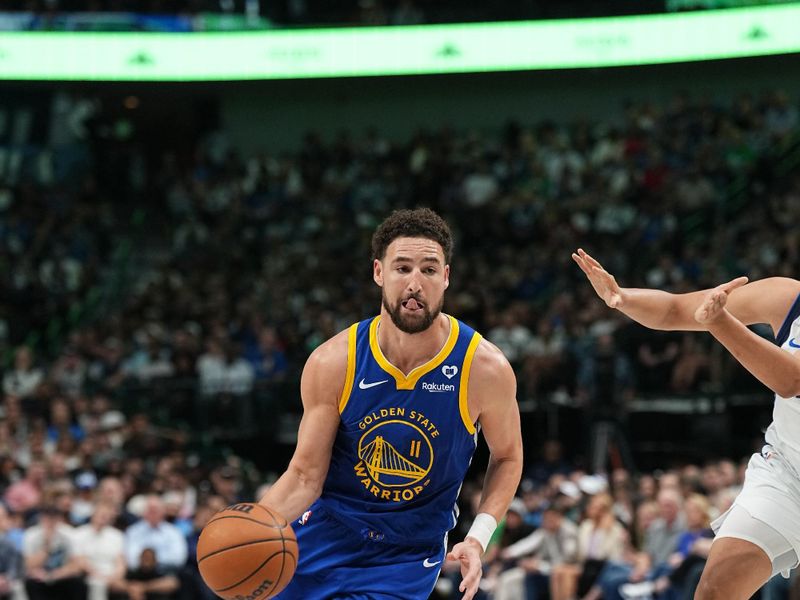 DALLAS, TX - MARCH 13: Klay Thompson #11 of the Golden State Warriors drives to the basket during the game against the Dallas Mavericks on March 13, 2024 at the American Airlines Center in Dallas, Texas. NOTE TO USER: User expressly acknowledges and agrees that, by downloading and or using this photograph, User is consenting to the terms and conditions of the Getty Images License Agreement. Mandatory Copyright Notice: Copyright 2024 NBAE (Photo by Glenn James/NBAE via Getty Images)