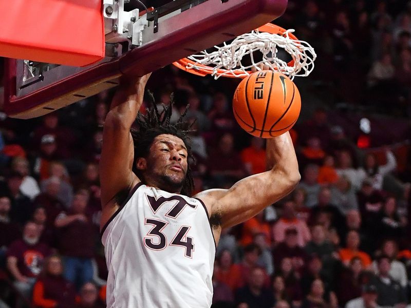 Jan 27, 2024; Blacksburg, Virginia, USA; Virginia Tech Hokies forward Mylyjael Poteat (34) dunks during the second half at Cassell Coliseum. Mandatory Credit: Brian Bishop-USA TODAY Sports