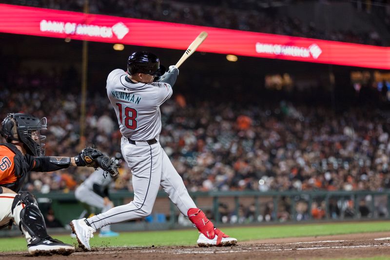 Apr 19, 2024; San Francisco, California, USA;  Arizona Diamondbacks shortstop Kevin Newman (18) hits a two-run single against the San Francisco Giants during the seventh inning at Oracle Park. Mandatory Credit: John Hefti-USA TODAY Sports