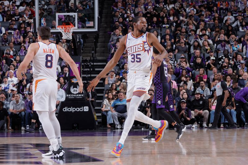 SACRAMENTO, CA - APRIL 12: Kevin Durant #35 high fives Grayson Allen #8 of the Phoenix Suns during the game against the Sacramento Kings on April 12, 2024 at Golden 1 Center in Sacramento, California. NOTE TO USER: User expressly acknowledges and agrees that, by downloading and or using this Photograph, user is consenting to the terms and conditions of the Getty Images License Agreement. Mandatory Copyright Notice: Copyright 2024 NBAE (Photo by Rocky Widner/NBAE via Getty Images)