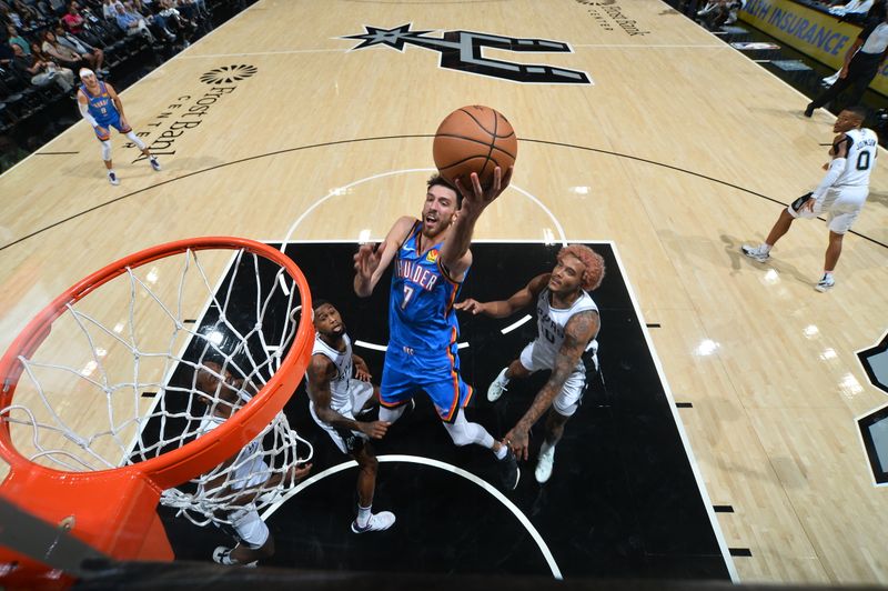 SAN ANTONIO, TX - OCTOBER 7: Chet Holmgren #7 of the Oklahoma City Thunder drives to the basket during the game against the San Antonio Spurs during a NBA preseason game on October 7, 2024 at the Frost Bank Center in San Antonio, Texas. NOTE TO USER: User expressly acknowledges and agrees that, by downloading and or using this photograph, user is consenting to the terms and conditions of the Getty Images License Agreement. Mandatory Copyright Notice: Copyright 2024 NBAE (Photos by Michael Gonzales/NBAE via Getty Images)