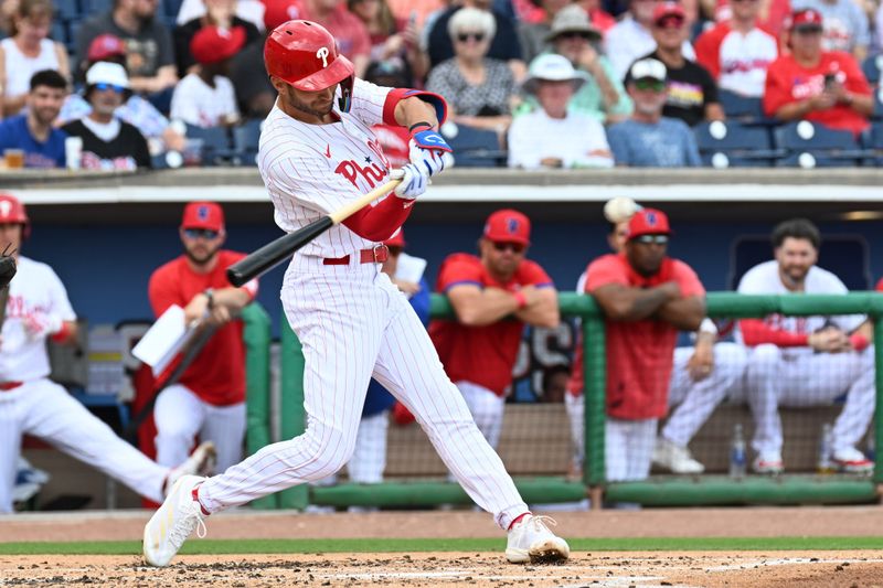 Mar 1, 2024; Clearwater, Florida, USA; Philadelphia Phillies shortstop Trea Turner (7) hits a double in the first inning against the Miami Marlins  at BayCare Ballpark. Mandatory Credit: Jonathan Dyer-USA TODAY Sports