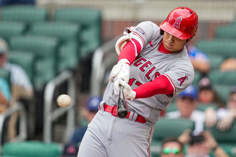 Aug 2, 2023; Cumberland, Georgia, USA; Los Angeles Angels designated hitter Shohei Ohtani (17) hits a single against the Atlanta Braves during the first inning at Truist Park. Mandatory Credit: Dale Zanine-USA TODAY Sports